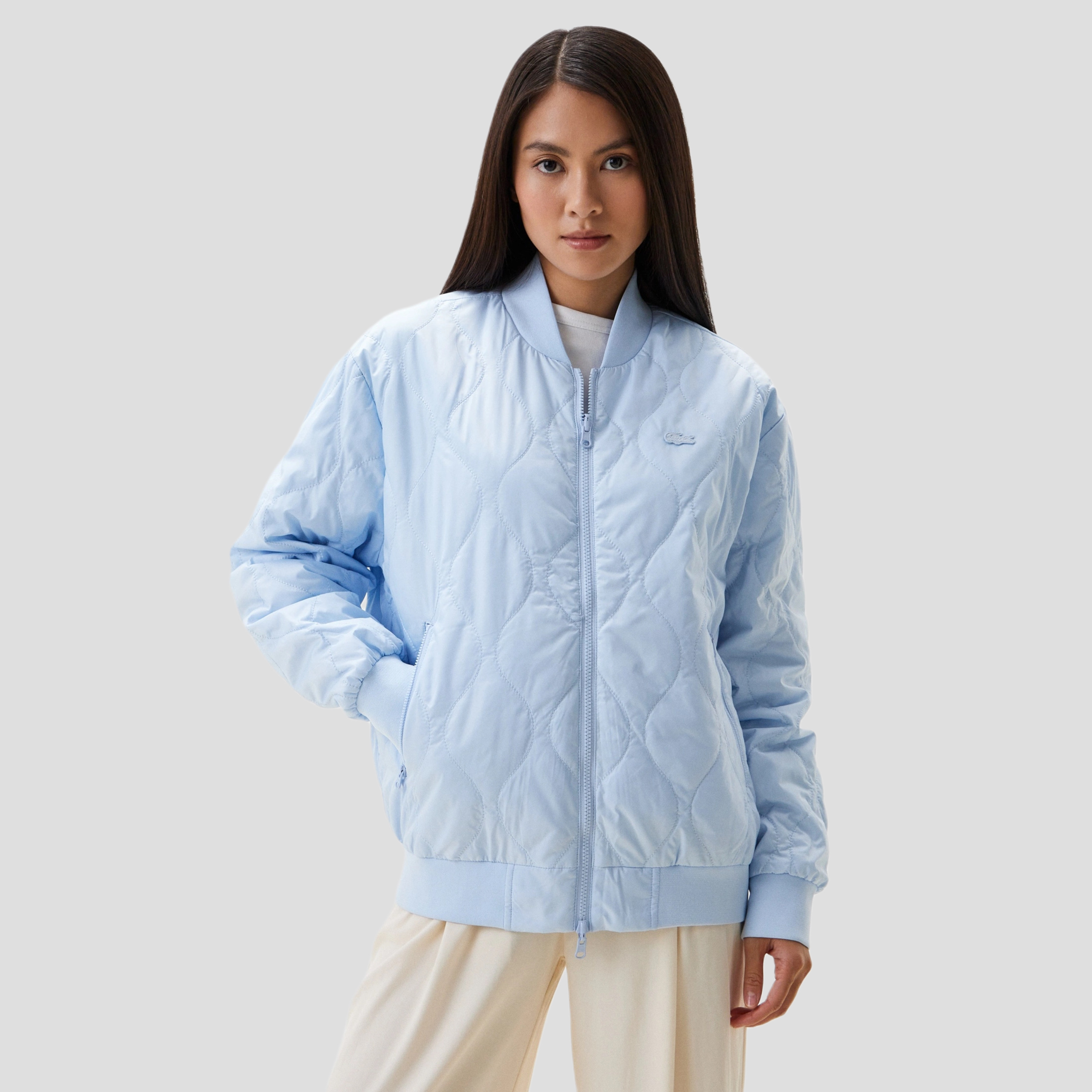 фото Женская стёганая двухсторонняя куртка lacoste