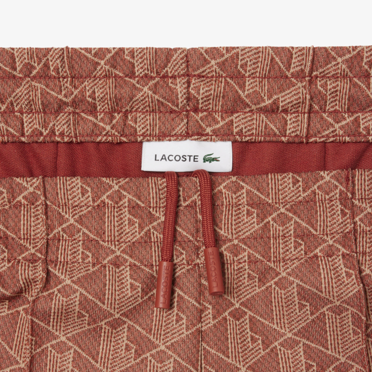 Женские расклешенные спортивные брюки Lacoste с монограммой