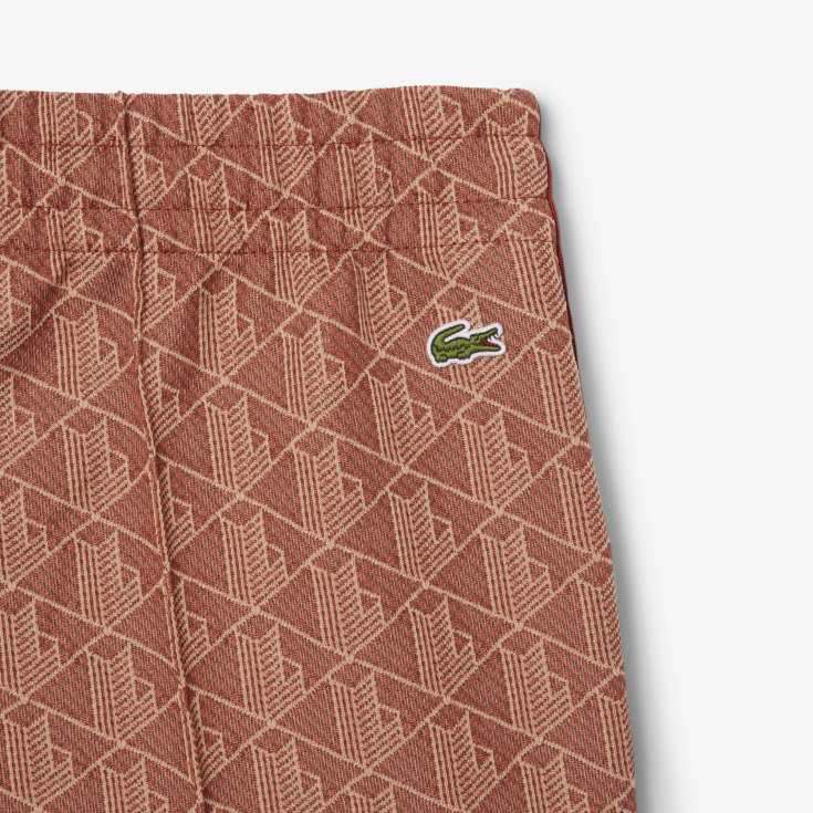 Женские расклешенные спортивные брюки Lacoste с монограммой