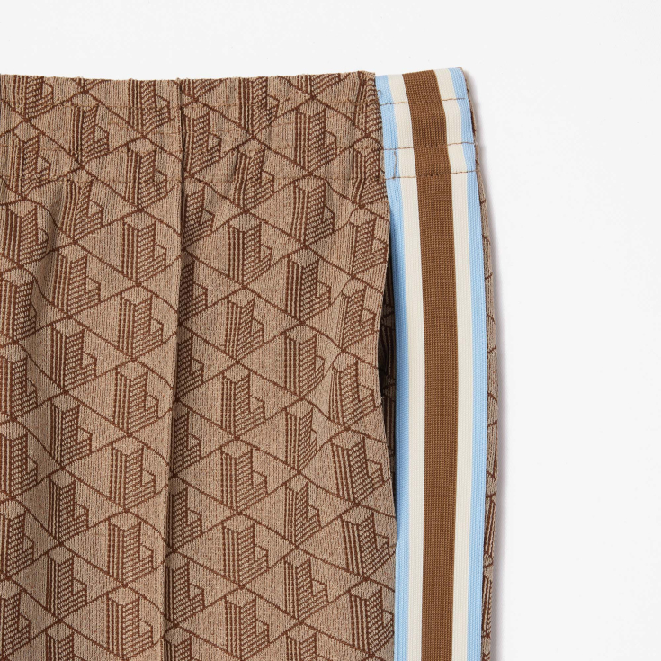 Женские расклешенные спортивные брюки Lacoste с монограммой