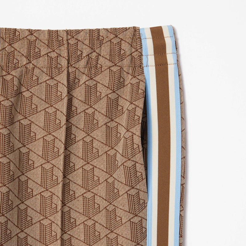 Женские расклешенные спортивные брюки Lacoste с монограммой