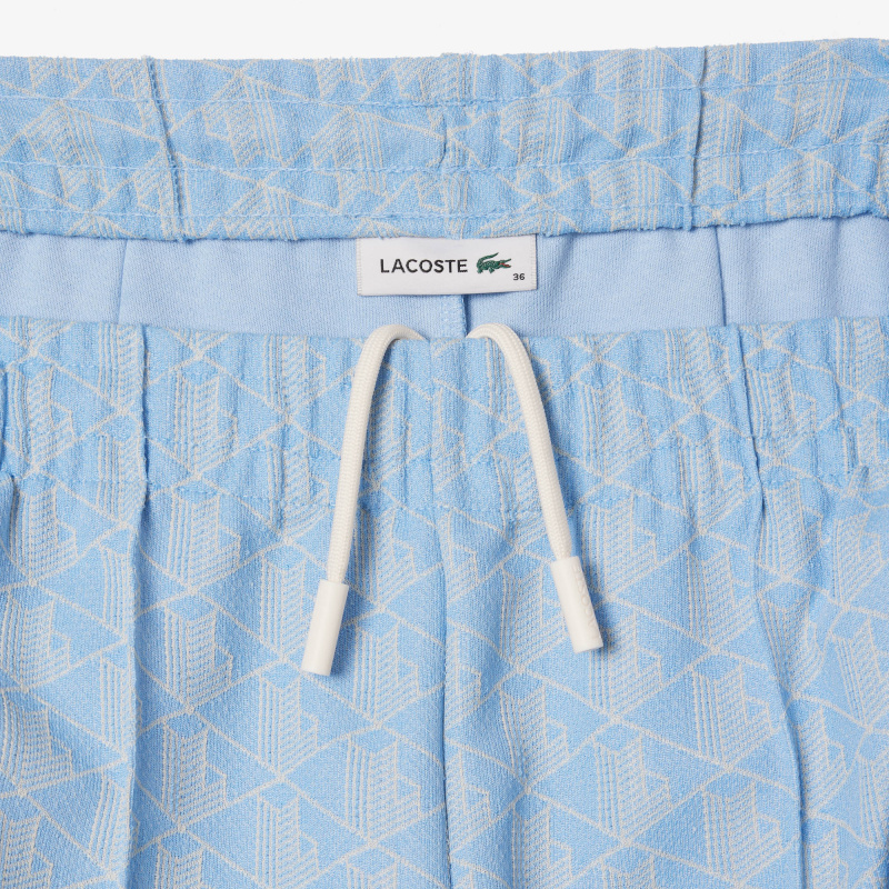 Женские расклешенные спортивные брюки Lacoste с монограммой