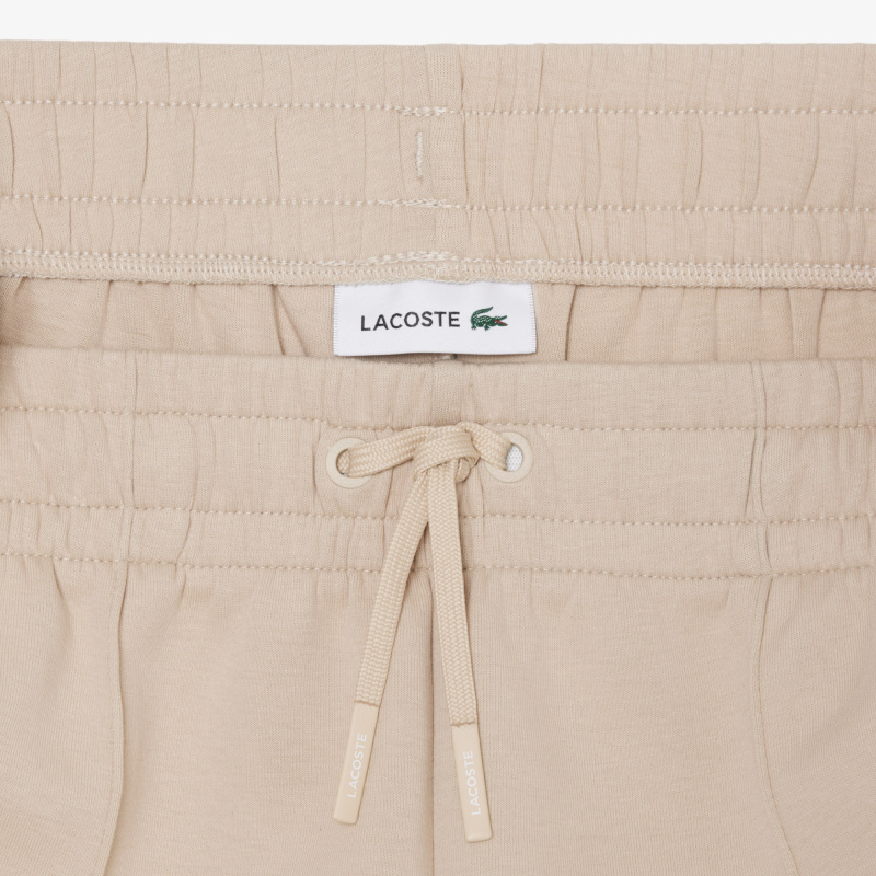 Женские хлопковые спортивные брюки-клёш Lacoste