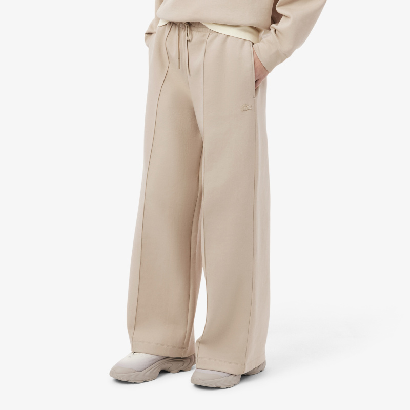 Женские хлопковые спортивные брюки-клёш Lacoste