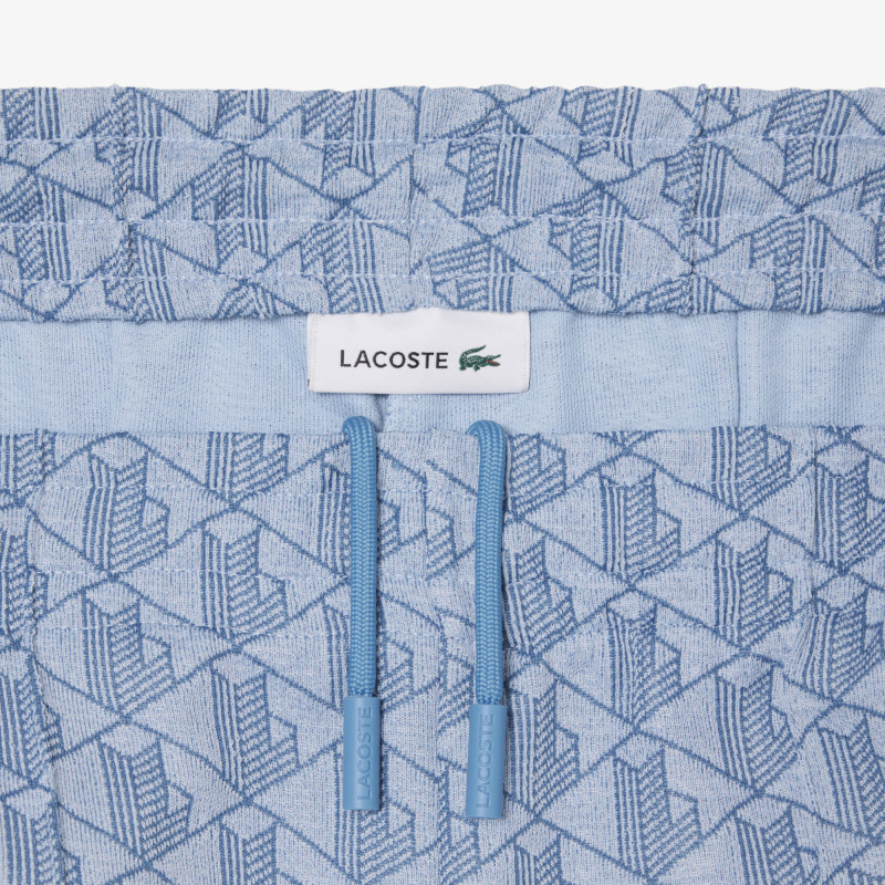 Женские расклешенные спортивные брюки Lacoste с монограммой