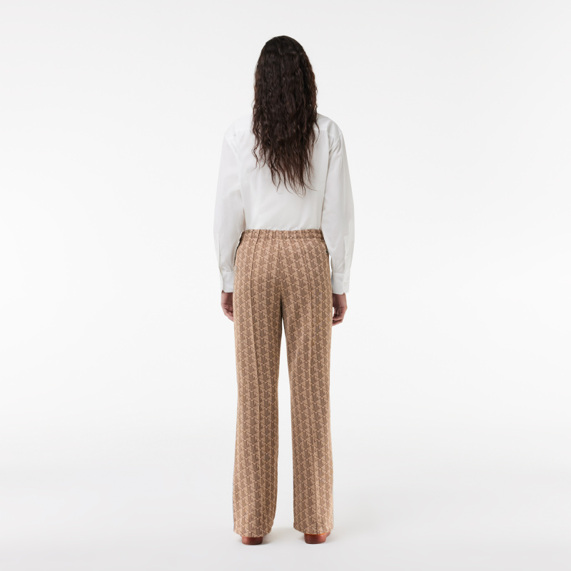 Женские расклешенные спортивные брюки Lacoste с монограммой