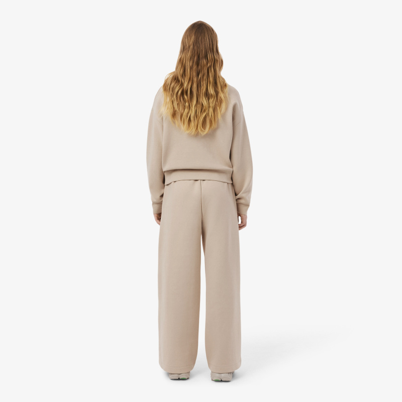 Женские хлопковые спортивные брюки-клёш Lacoste